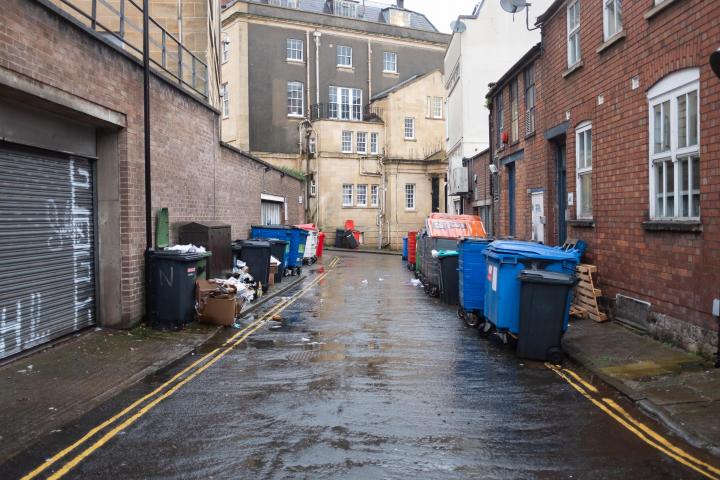 What a vista of urban delight. On the plus side, a sign on one of the bins reminded us that Pinkmans was just aroudn the corner.