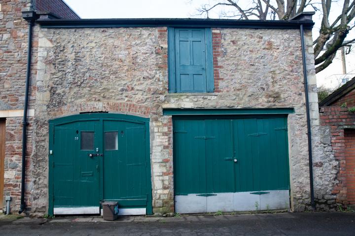 A stables, later used as a coach house built to serve No. 16 Vyvyan Terrace (qv), c.1840. Built from rough rubble Pennant stone and brick with a fe...