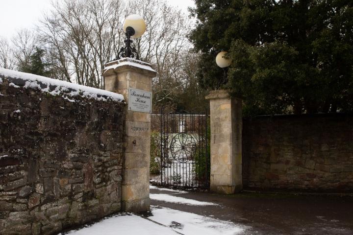 Between them, the old signs on the left and right pillar say ROWNHAM LODGE, but the modern metal sign says Rownham House. Are these the gates for b...