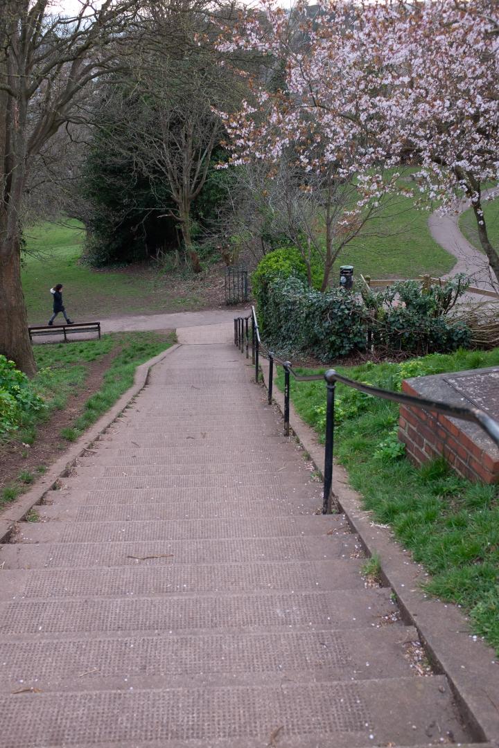 The steps come out down by the bowling green.