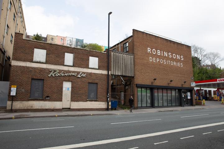 I know very little about the history of these buildings. There's a removals firm called Robinsons with some links to Bristol, and a building in Bri...