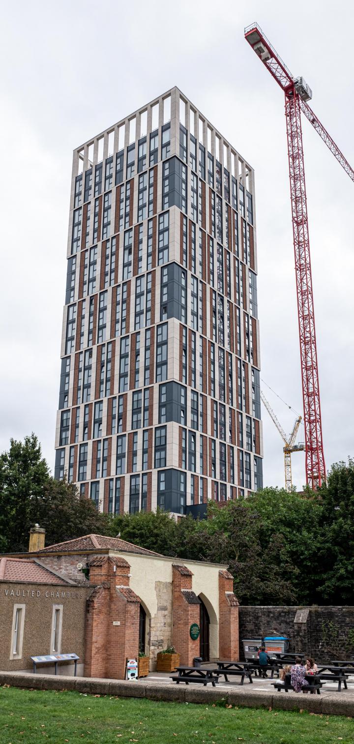 And towering over one of Bristol's oldest buildings, here's one of Bristol's newest, Castle Park View. Its 26 storeys towering up at 98 metres, it'...