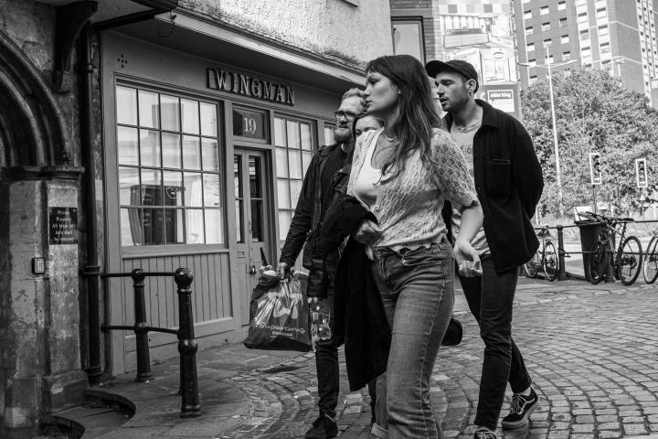 I figured I'd try a bit of street photography, seeing as there were actually people around. This isn't bad for a from-the-hip shot, but I'm a bit o...