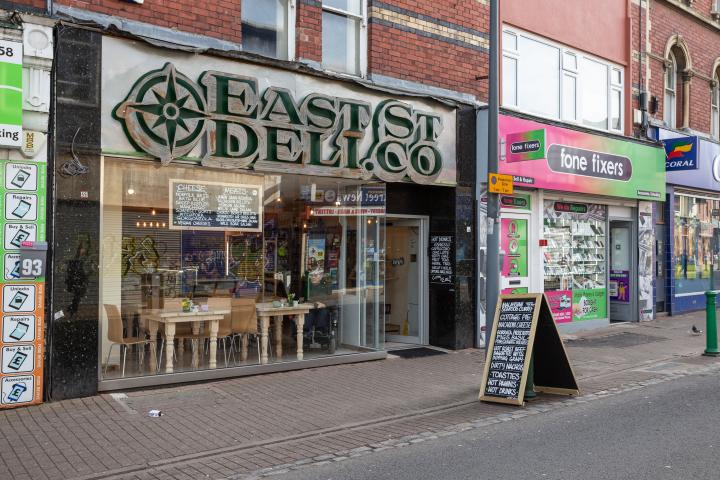 It's a strange mix of shops. This rather high-end sounding deli is sandwiched between two mobile phone repair places.