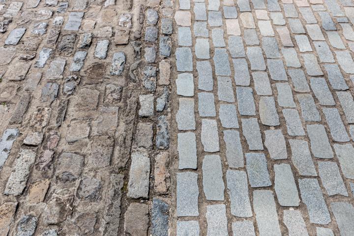 Just around the corner, you can see the old and newly-halved-and-relaid cobbles next to each other. (Technically I think these are actually setts,...