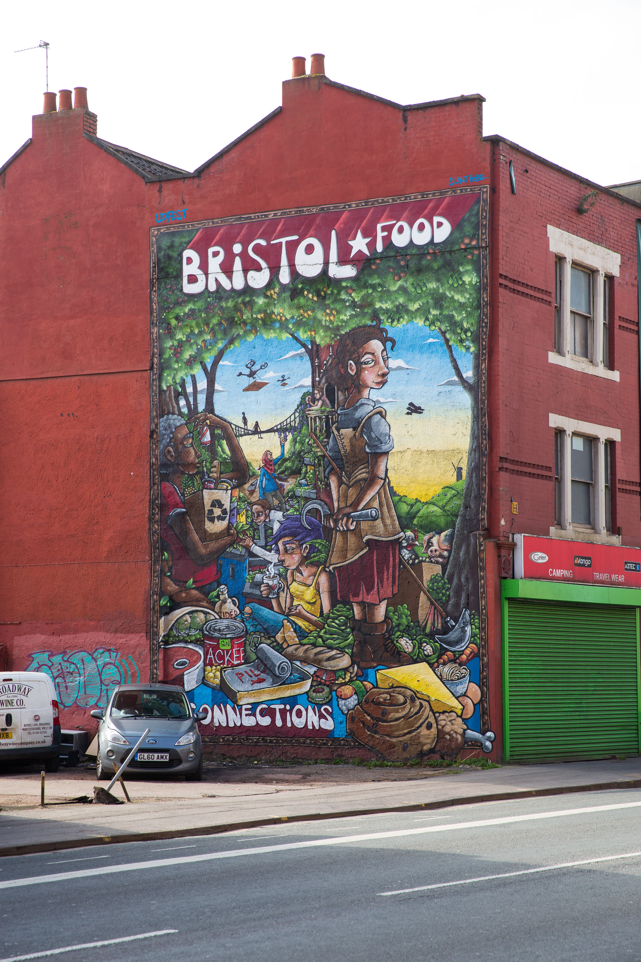 Bristol Food Connections
One day I'll get a decent picture of this mural without a sodding car parked in front of it.

EDIT: I never did, and now they've built flats in fro...